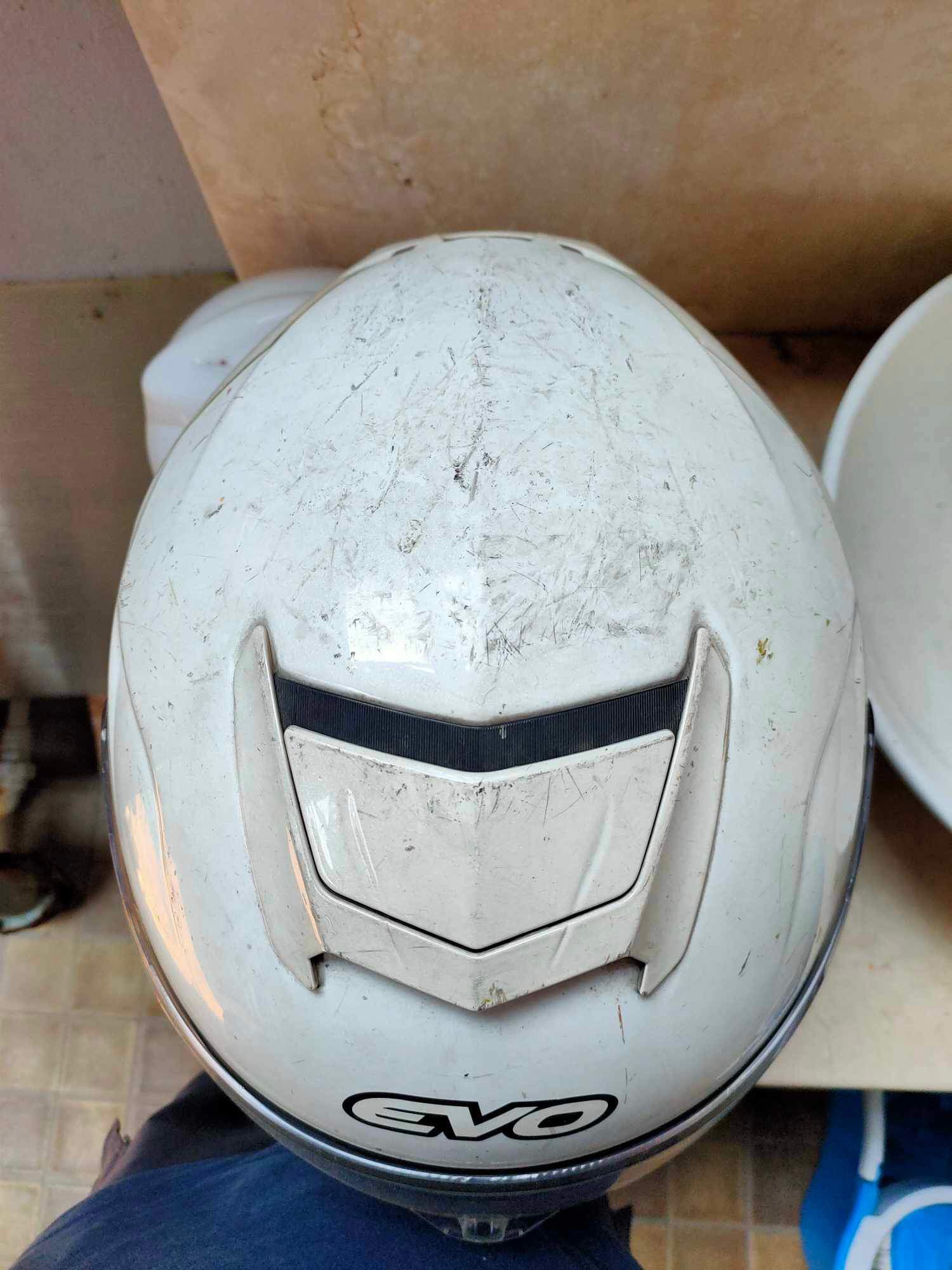 White motorcycle helmet before VBRO helmet care