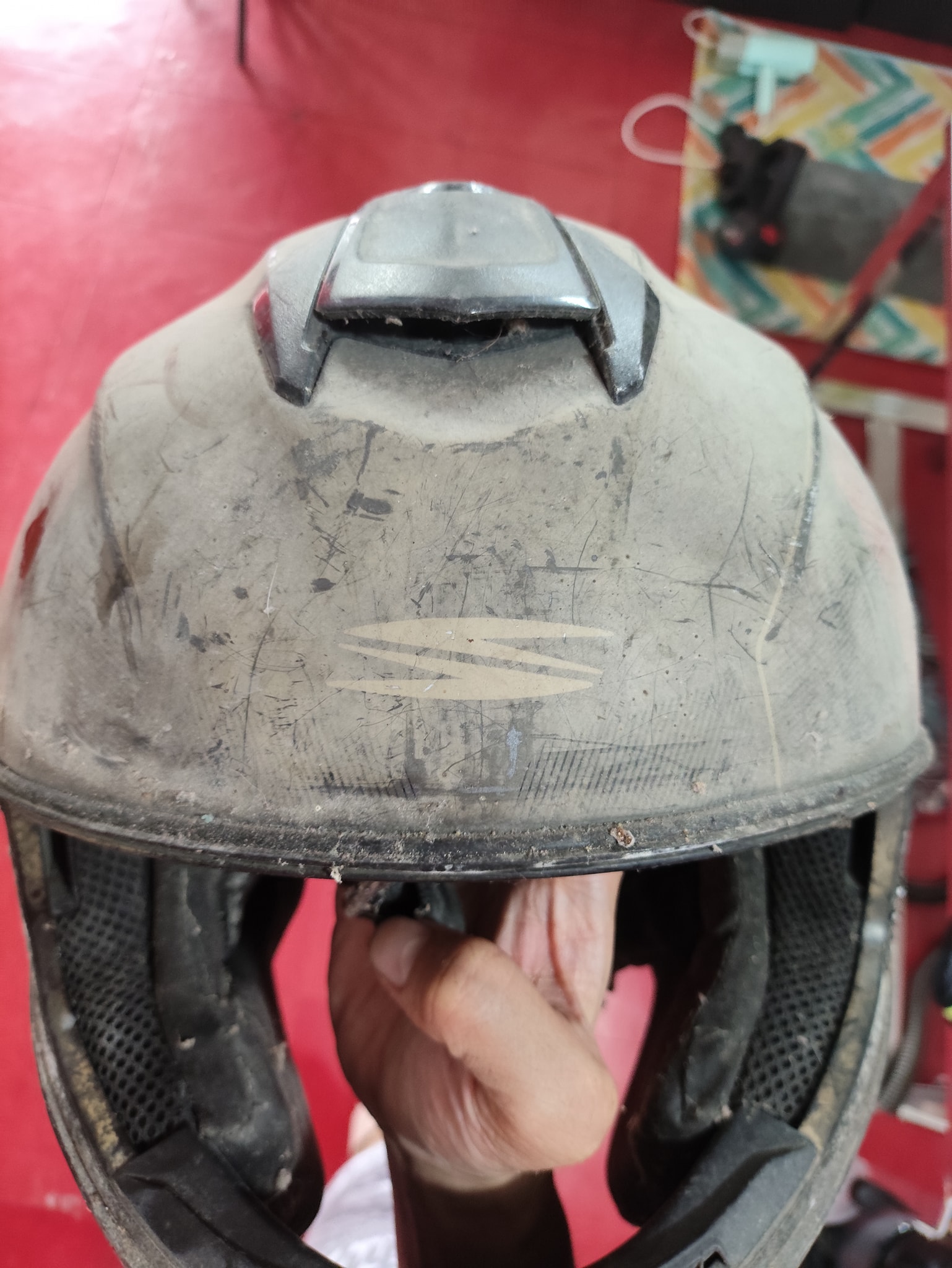 Gray motorcycle helmet before VBRO helmet care